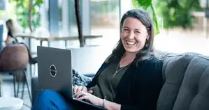 Sarah Juliasson working on laptop