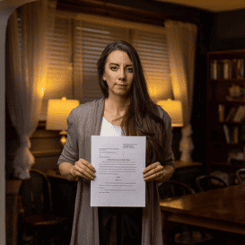 Lauren Richwine with legal document